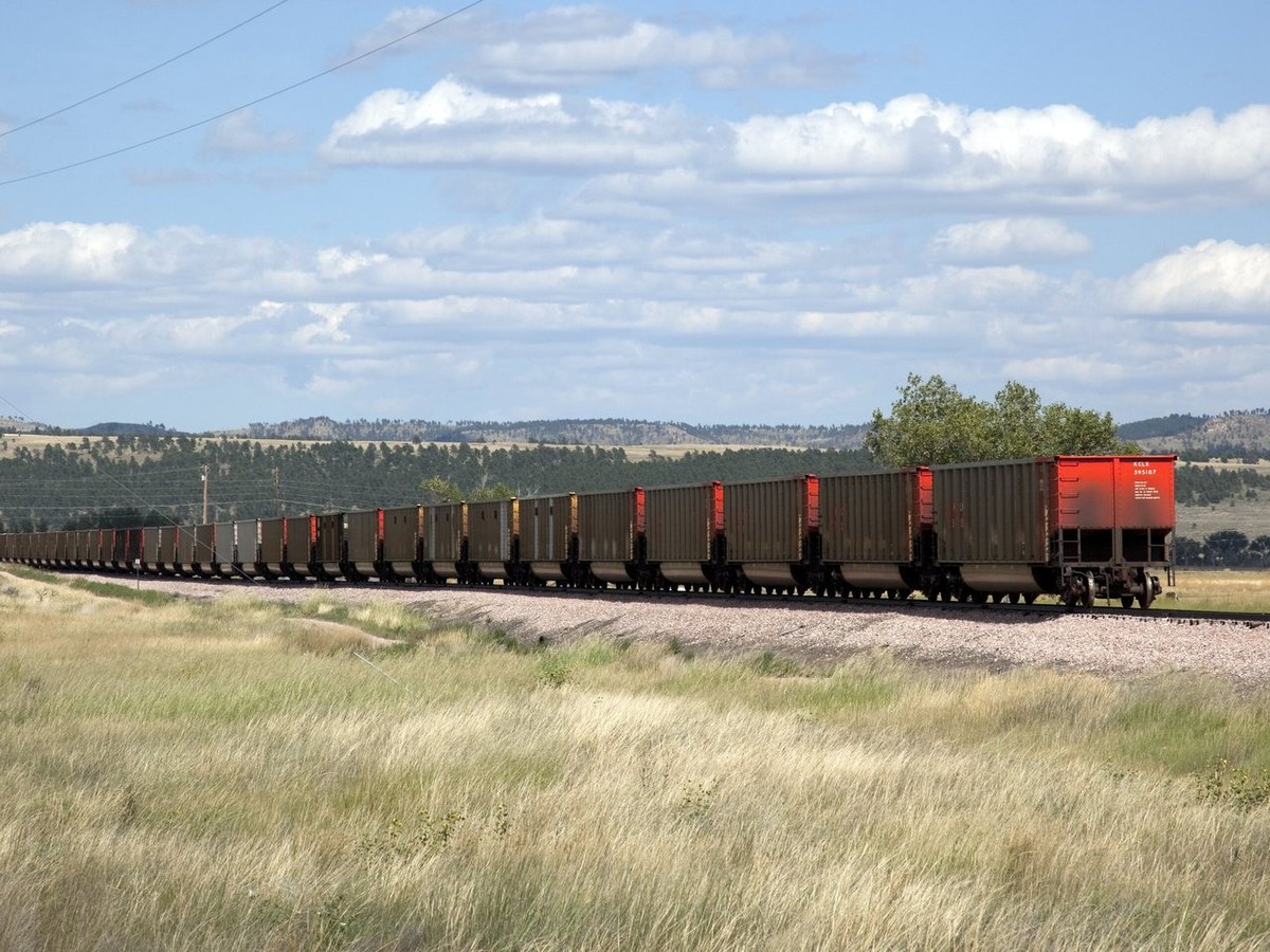 A freight train on timber railway ties in rural South Dakota